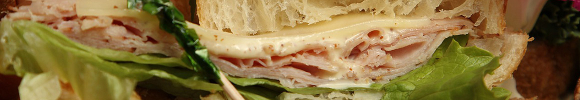 Eating Deli Sandwich Cheesesteak at Phillys Cafe & Deli restaurant in Hilton Head Island, SC.